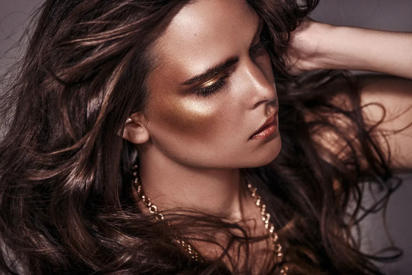Woman reclining in a patterned editorial fashion portrait