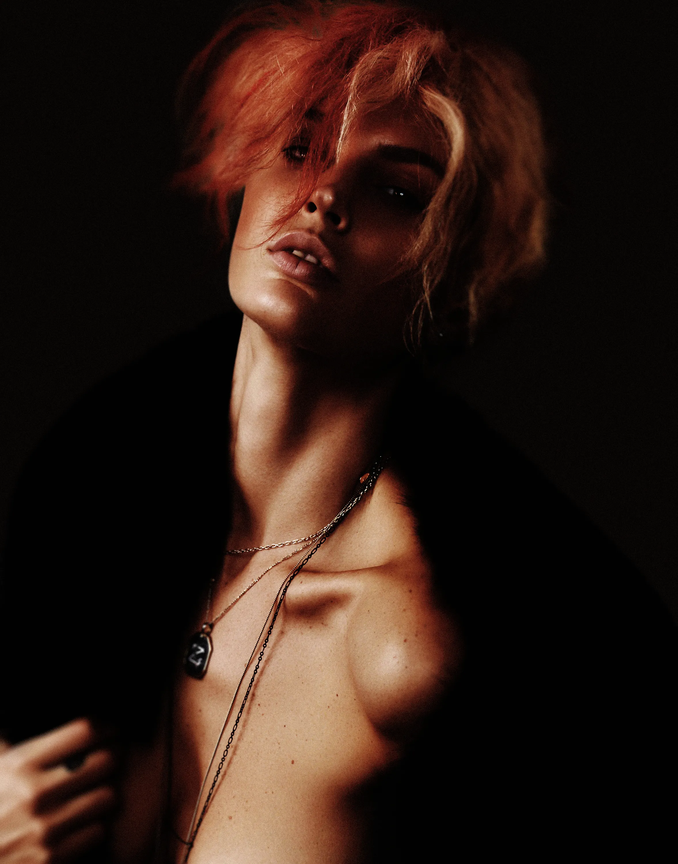 Red-haired model in a studio fashion portrait